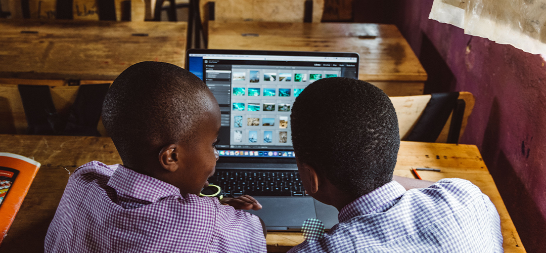 Teachers and students using technology in a modern classroom